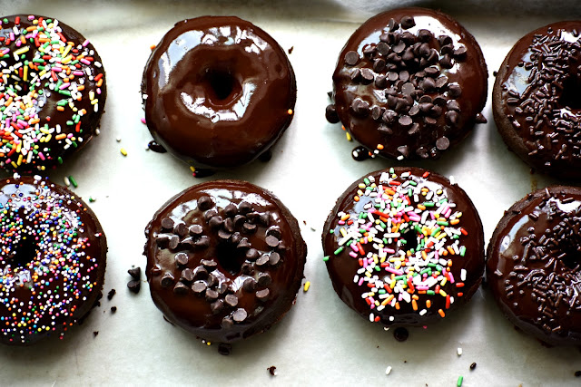 gluten free dairy free chocolate donuts on the counter with sprinkles on top 