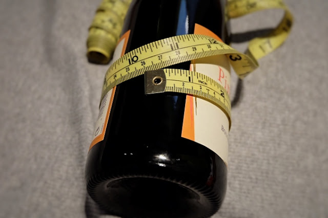 measuring a wine bottle