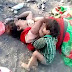 Sad photos of a crying 17- month-old boy who was found drinking milk from his mother's dead body in India Police in Damoh district, Madhya Pradesh, India,