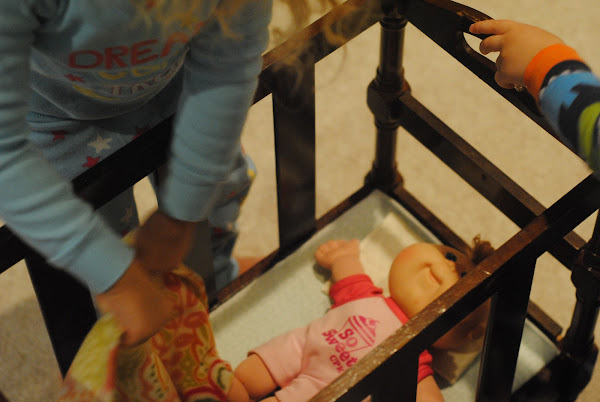 DIY doll crib from a thrift store magazine rack (doll furniture)