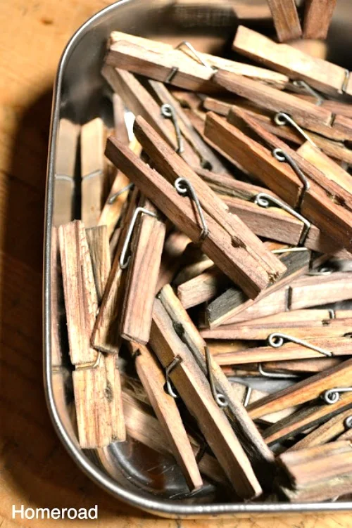 container of wooden clothespins aged with vinegar