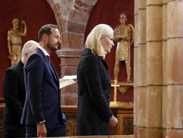 Crown Princess Mette-Marit and Crown Prince Haakon attended St. Magnus festival in Scotland. Prada dress, Christian Louboutin pumps