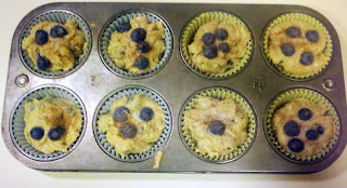 Muffin pan filled with white whole wheat blueberry muffin batter