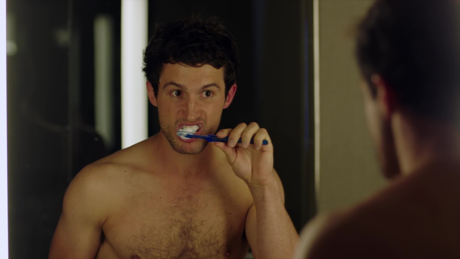 ausCAPS: Parker Young and Rob Heaps shirtless in Imposters 1