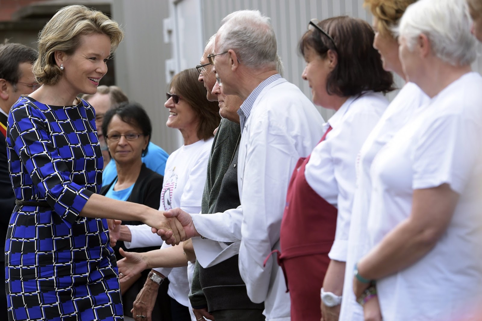 Queen Mathilde also had time to attend to some of the many people who had turned up to catch a glimpse of the Queen.