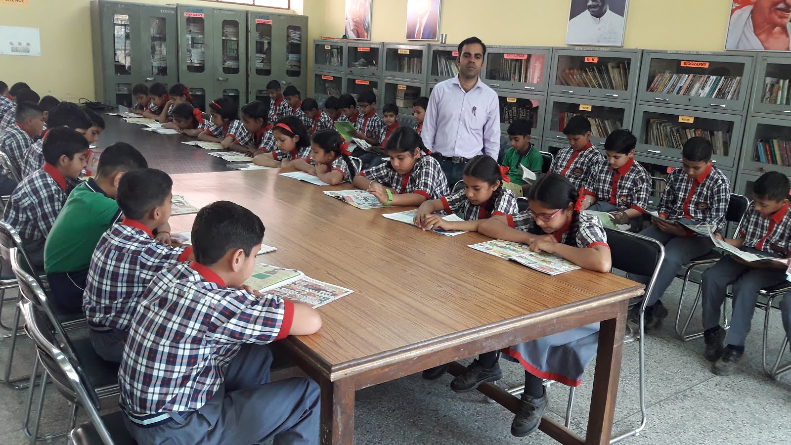 Students studing books during library period