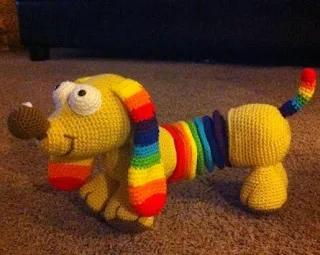 http://www.craftsy.com/pattern/crocheting/toy/rainbow-slinky-dog/96142