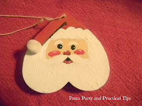 Santa painted on a wooden heart 