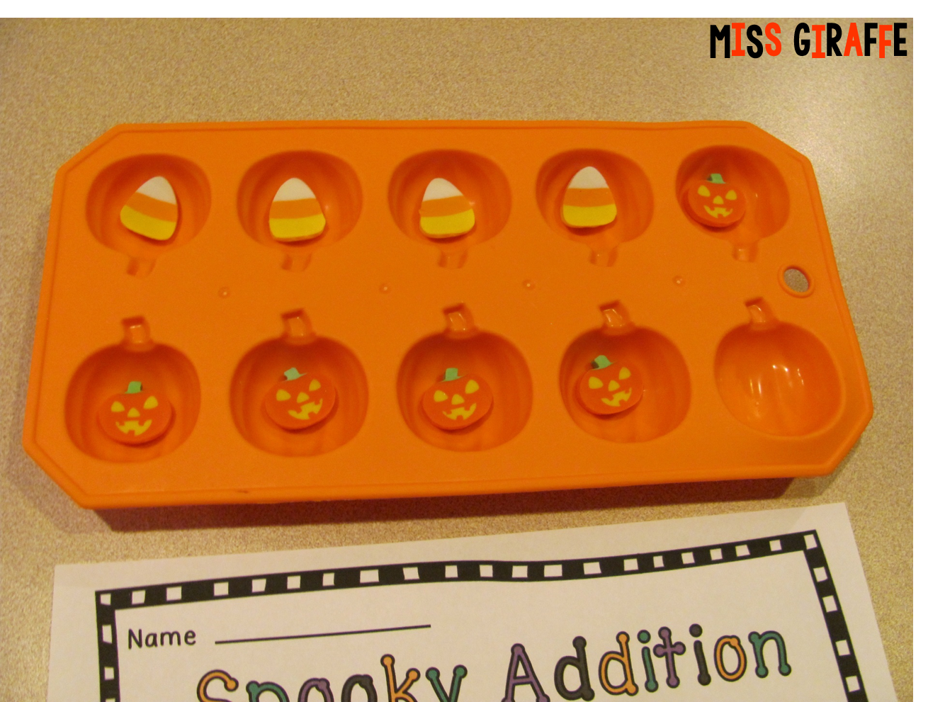Halloween Math Games to play with pumpkin ice cube trays from the dollar store and mini erasers