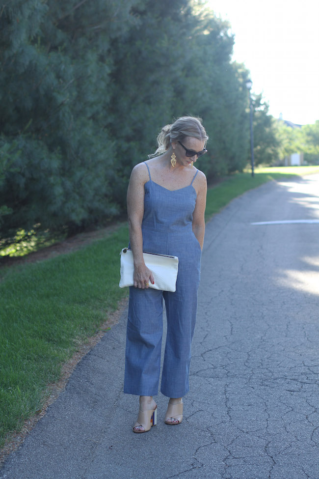 chambray jumpsuit, wedge sandals, white clutch
