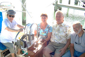 Paula's parents (Dora & John) and Aunt Ilene at the helm