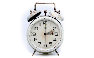 Old Alarm clock :  Get free image of old body white alarm clock with some rust on clock outside body.