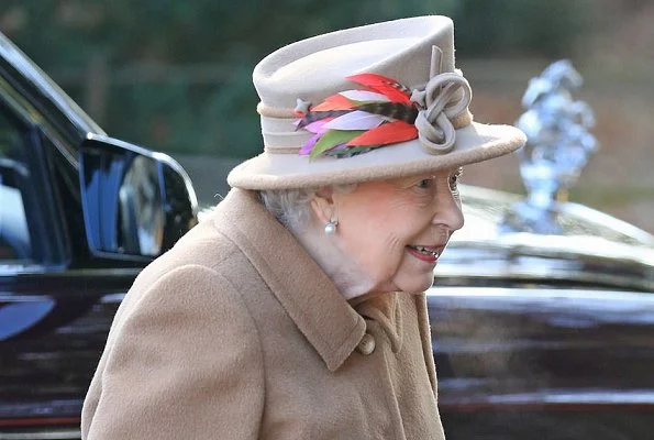 Queen Elizabeth and Prince Andrew attended Sunday Service. The Queen wore a light brown coat and hat decorated with feathers