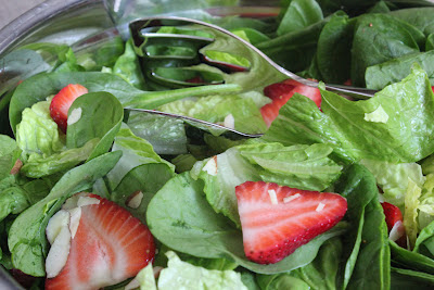 Green salad with strawberries and strawberry vinaigrette