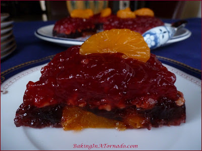 Cranberry Holiday Jello, a jello based holiday treat that includes cranberry sauce, fruits and nuts | Recipe developed by www.BakingInATornado.com | #recipe #Thanksgiving
