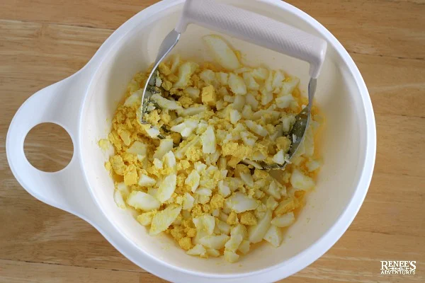 Chopped hard boiled eggs in a white bowl
