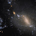 Teleskop Antariksa Hubble Amati Dua Galaksi yang Saling Menyatu