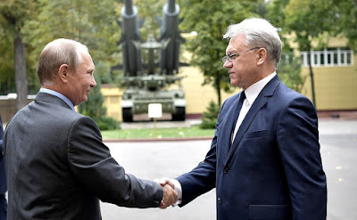 Vladimir Putin at the Almaz-Antey Air and Space Defense Corporation with Director General Yan Novikov. Vladimir Putin at the Almaz-Antey Air and Space Defense Corporation with Director General Yan Novikov.