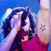 Mega star tattoo under arm 