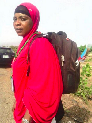 woman trekking for buhari