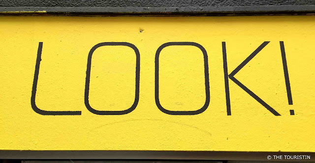 The word LOOK on yellow ground