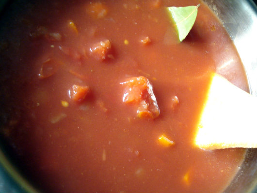 add tomato, bay leaf and water