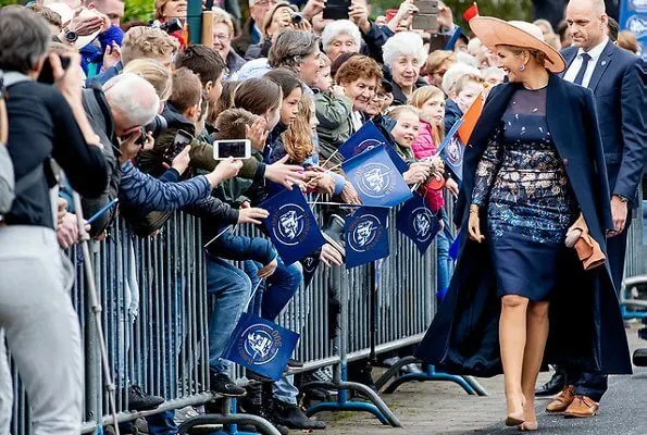 Queen Maxima wore a new embroidered dress by Natan Couture. The company is now officially named Royal Swinkels Family