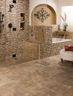 Different styles of tile mix well on the floor & walls of this bath
