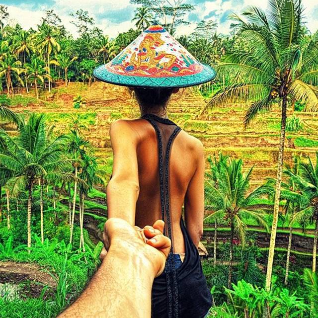 Photographer Murad Osmann creatively documents his travels around the world with his girlfriend leading the way in his ongoing series known as Follow Me To. Chronicling his adventures on Instagram, the Russian photographer composes each shot in a similar fashion. We see each landscape from the photographer's point of view with his extended hand holding onto his girlfriend's in front of him.