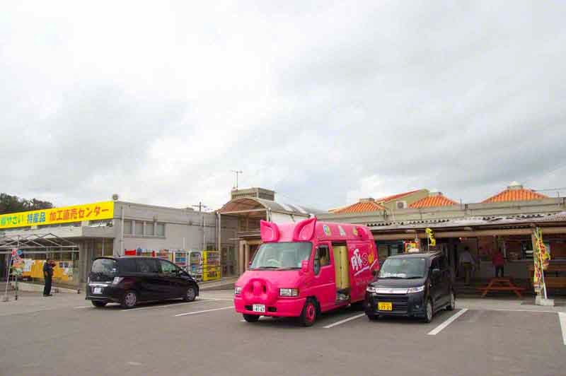 parking lot scene, pink pig mobile