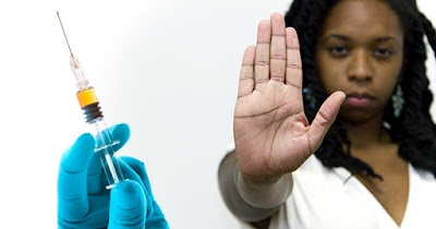 Black woman rejecting flu shot