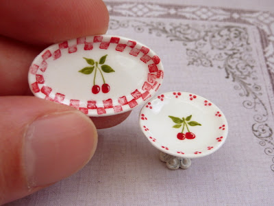 Handpainted miniature plate and cake stand in red and white with a cherry motif.Handmade by Paris Miniatures - Emmaflam and Miniman