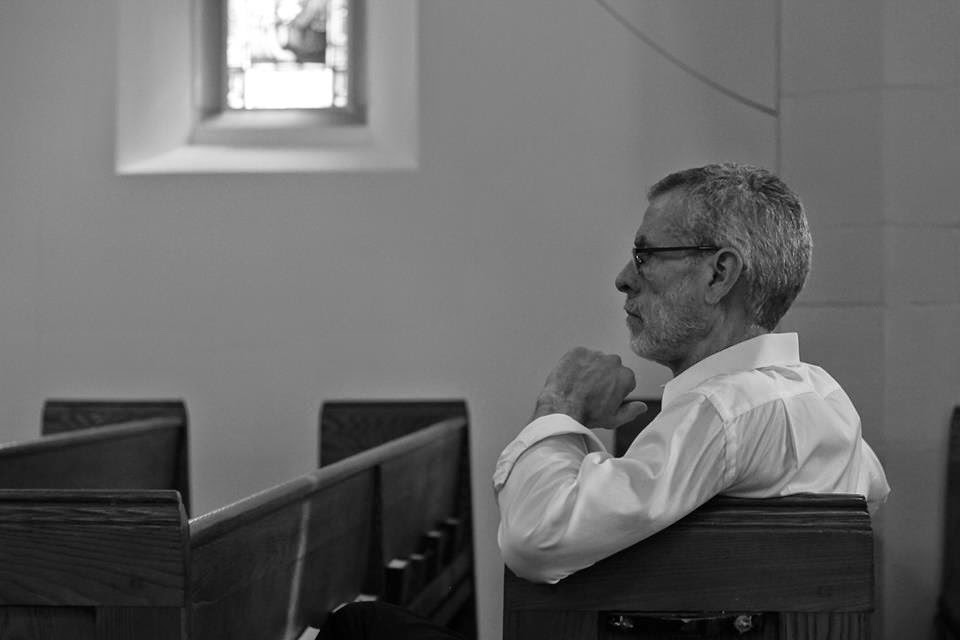 Steve Schalchlin in church watching rehearsal. 