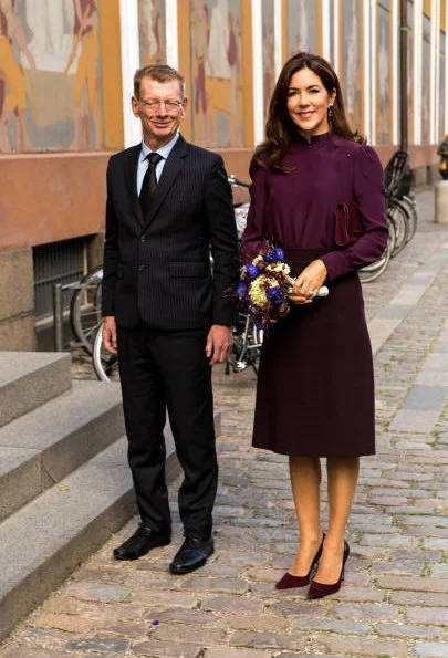 Crown Princess Mary, wore a burgundy blouse and burgundy skirt, Prada suede pumps, she carries Hugo Boss clutch