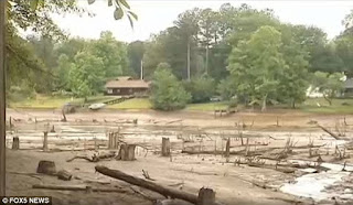 via http://www.dailymail.co.uk/news/article-3112436/Georgia-lake-existed-generations-completely-disappears-50-year-old-dam-gives-way-ferocious-thunderstorm.html