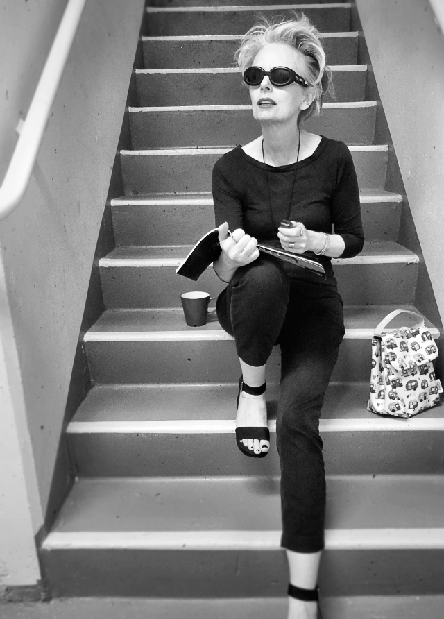 Image of Audrey Hepburn checking a bag