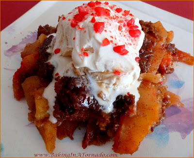 Crockpot Red Hot Ginger Snap Apple Cobbler: An apple cobbler kicked up a notch with ther addition of a ginger snap crust and a special ingredient. Easy to cook, right in your slow cooker. | Recipe developed by www.BakingInATornado.com | #recipe #dessert #crockpot