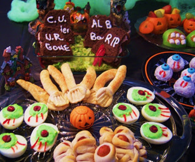 Creative and fun foods for a Halloween party Gravestone sandwiches, tangerine pumpkin fruit cups, apple peanut butter teeth, witches brew, mummy hotdogs, deviled egg eyeballs, donut eyeballs, dirt pies with worms, meatballs swimming in sauce faces, and English muffin faces