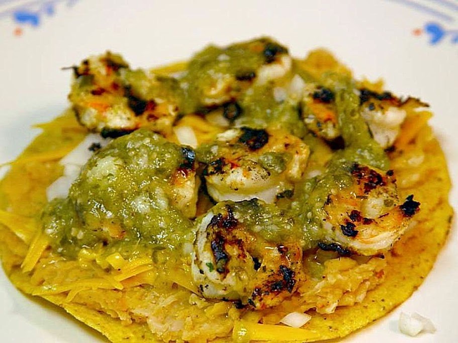 Easy Shrimp Tostadas, tortilla layered with beans, cheese,and grilled shrimp