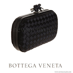 Queen Letizia carried Bottega Veneta black knot intrecciato satin clutch