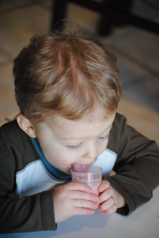 Cute little boy drinking smoothie