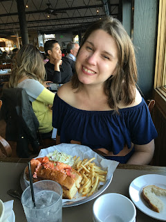 Sam's Chowderhouse Lobster Roll in Half Moon Bay in a strapless maternity dress