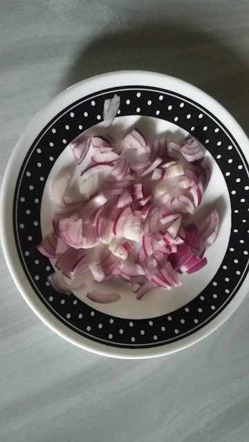 Freshly chopped red onions in a small round plate