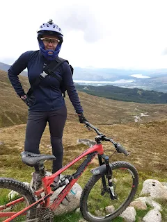woman seneca chino pants in the hills with mountain bike