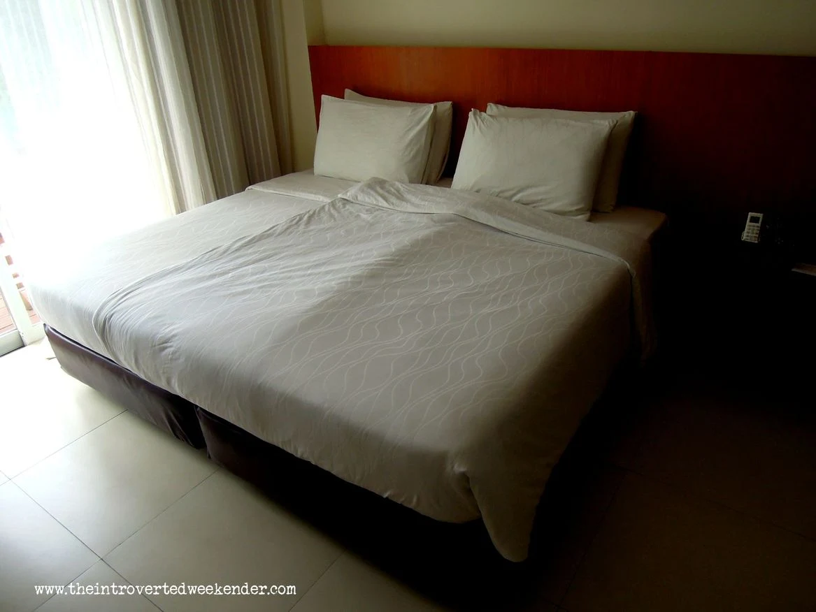 Our bed at Ocean Suites Boutique Hotel Bohol