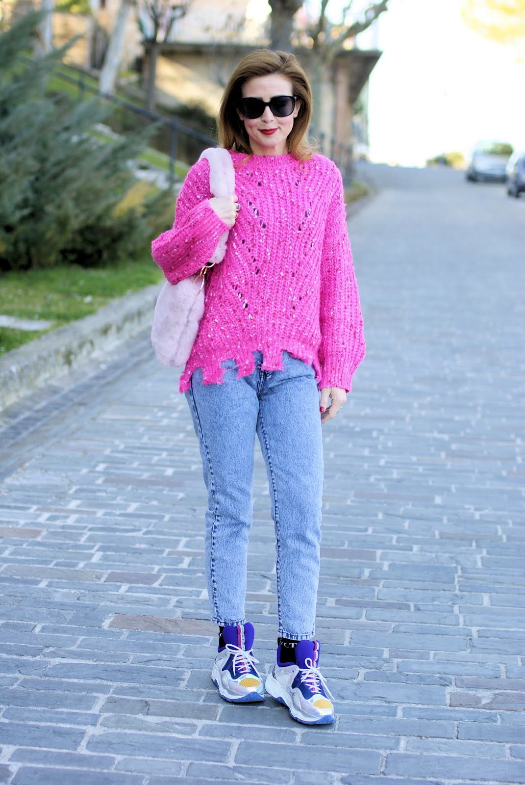 Casual outfit with a maxi distressed pink sweater and furry bag on Fashion and Cookies fashion blog