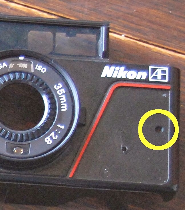 How to open a Nikon L35AF in this case, for a shutter release and on