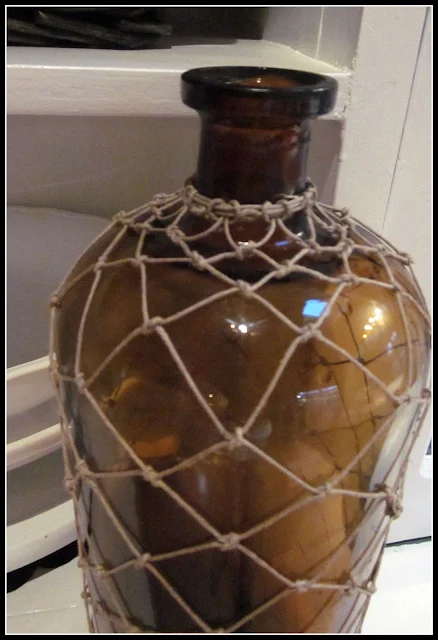 Amber antique bottle with macrame