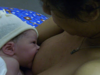 One Quarter Mama breast feeding newborn Little Man on OneQuarterMama.ca