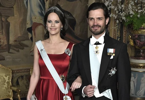 Crown Princess Victoria wore Green gown and Anya Hindmarch Gold Metallic Clutch Princess Sofia wore red gown and  silver diamond Metallic Clutch, diamond tiara.